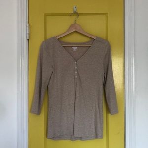 a soft and oversized sandy-colored shirt